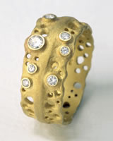 Original 'Pierced Ring' in matt finished gold with small diamonds